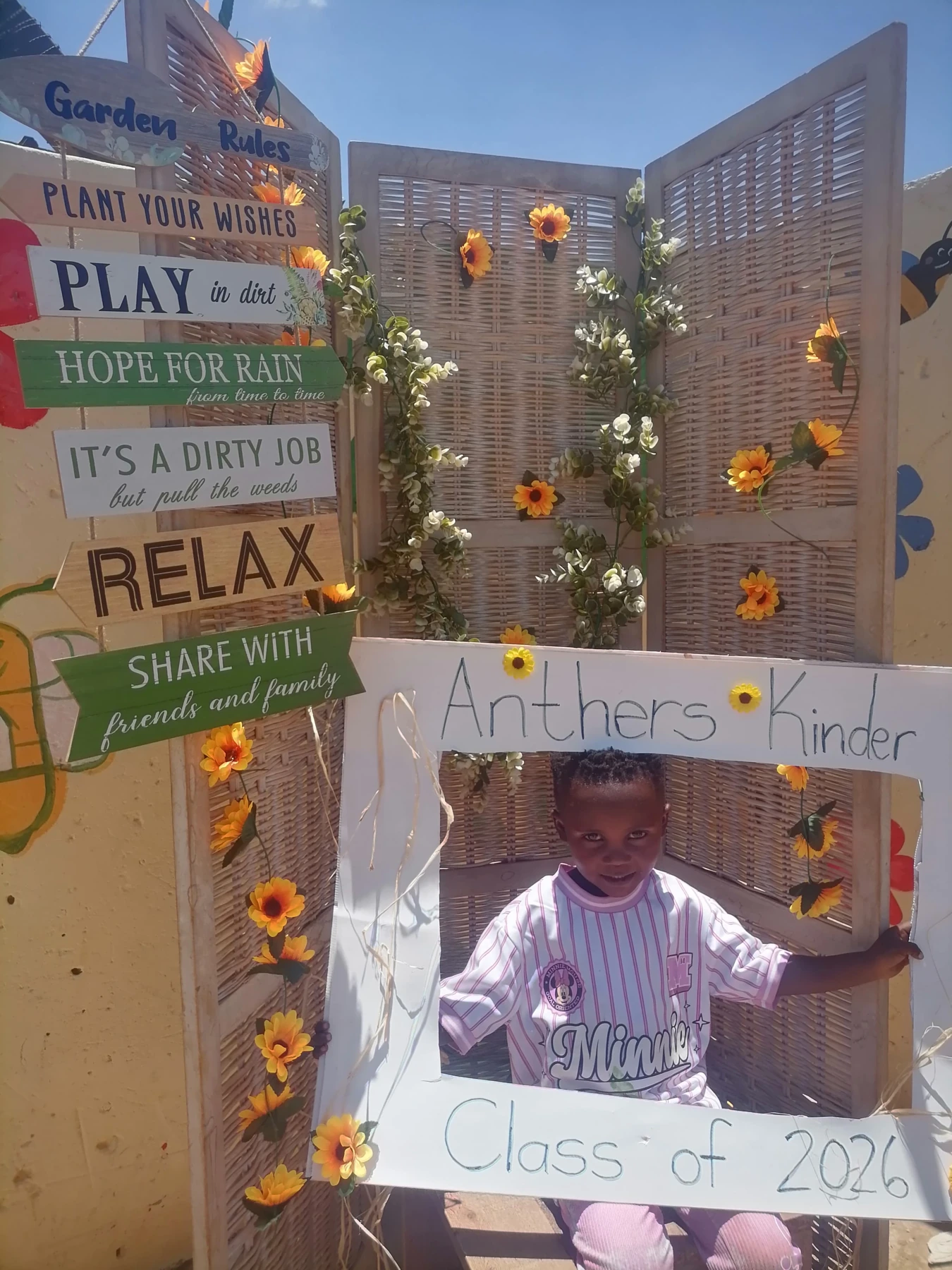 An Anthers Kinder pupil smiling in the school celebration frame